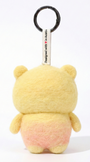 Back view of a handmade Woobbi bear keychain, made from yellow and pink bubbly wool felt. It features a small tag that says 'Designed with ❤️ in Austin' and a round black metal keyring. The sheep has small yellow ears. It is set against a plain white background.