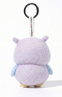 Back view of a handmade Woobbi owl keychain, showing its rounded lavender wool felt body and small pointed ears. The keychain features light blue wings on the sides and a white tag attached to the top that reads 'Designed with ❤️ in Austin'. A round black metal keyring is connected to the tag. The product is set against a pure white background.
